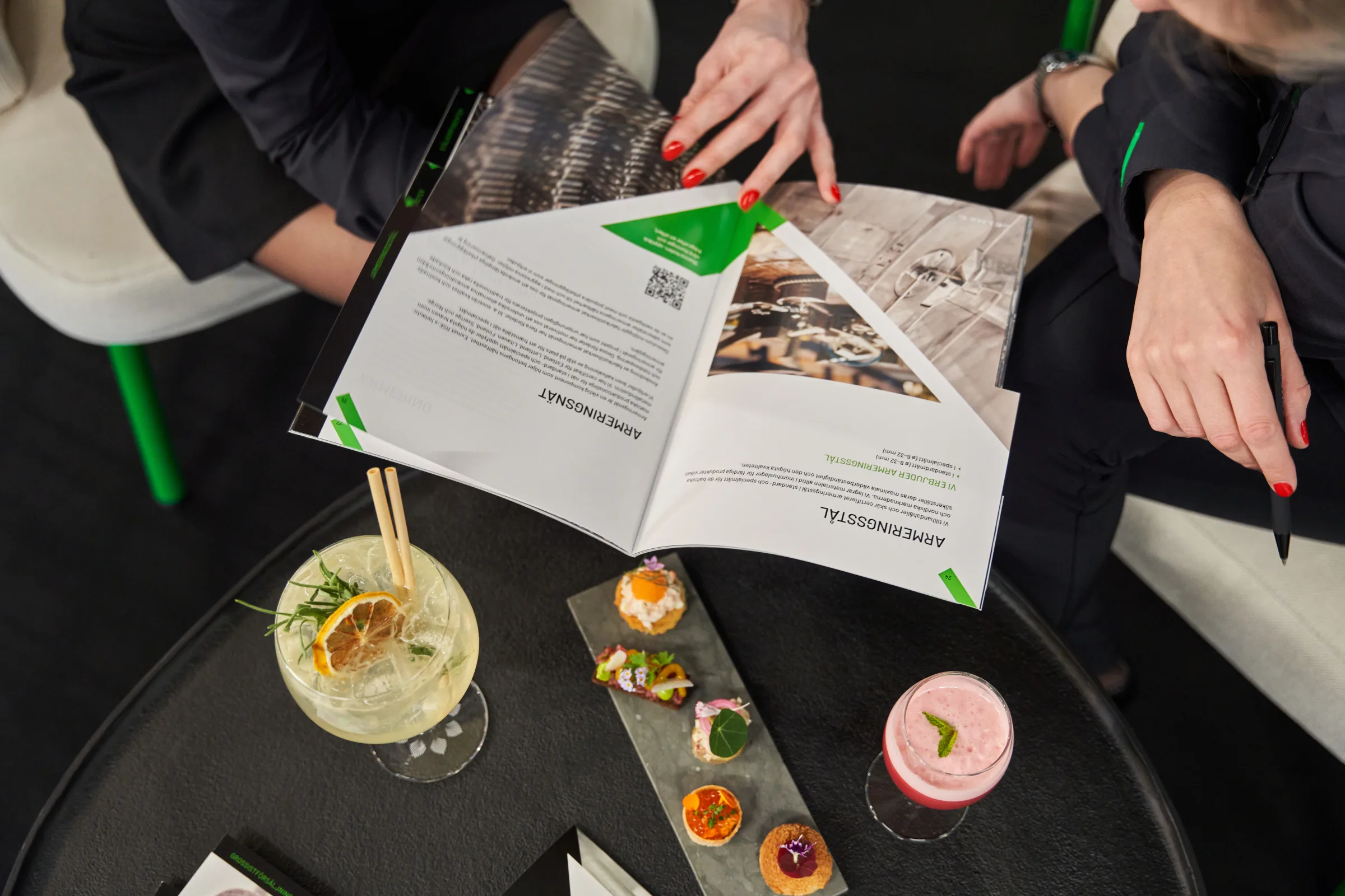 Hands sharing small plates at the Exmet stand